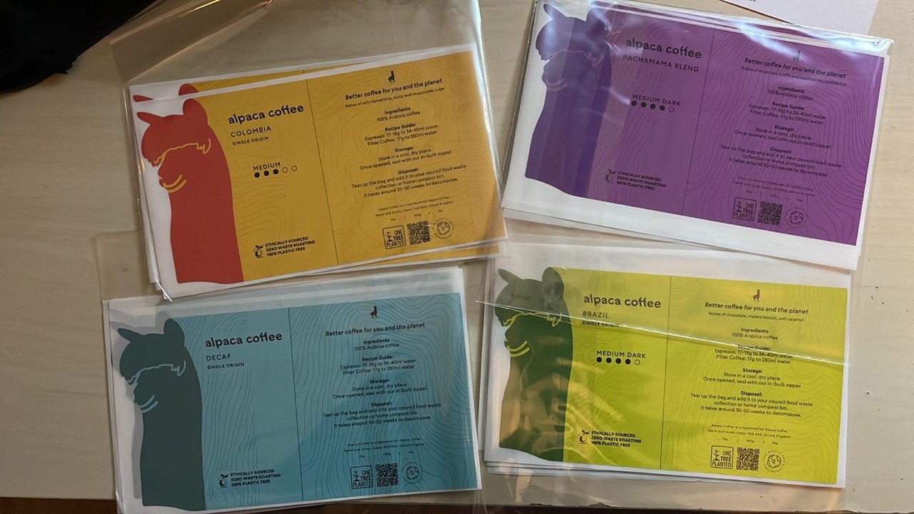 Alpaca Coffee packaging redesign prototype suite with colourful coffee pouch labels.